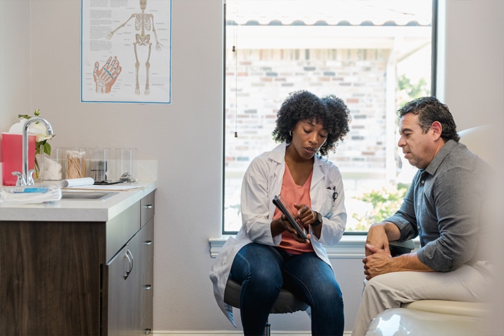 Doctor And Patient In Exam Room