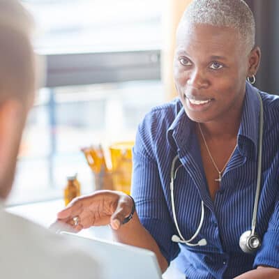 Doctor Talking To Patient No Lab Coat