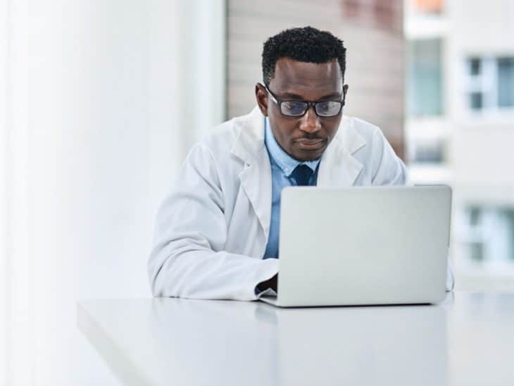 Male Doctor With Laptop