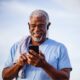 Man With Headphones in Blue Shirt