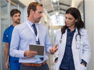 Consultant With Doctor In Hall