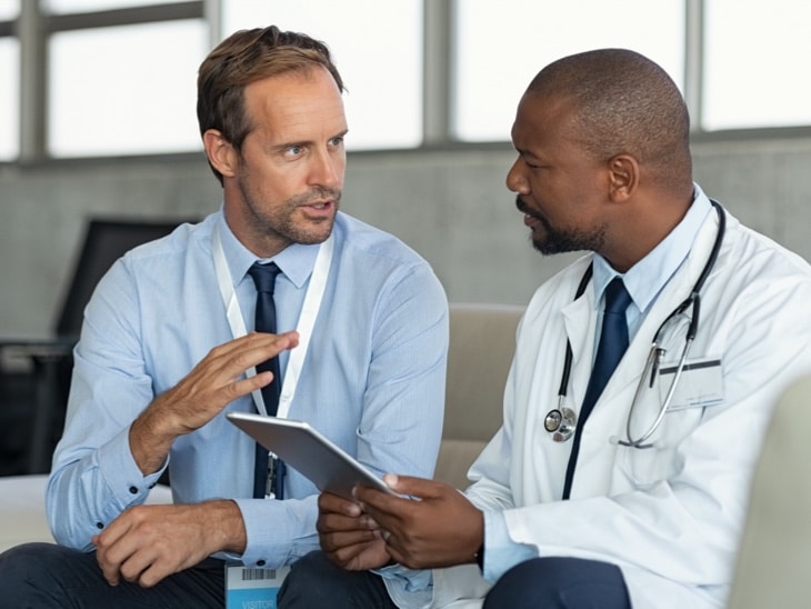 Consultant With Doctor Seated