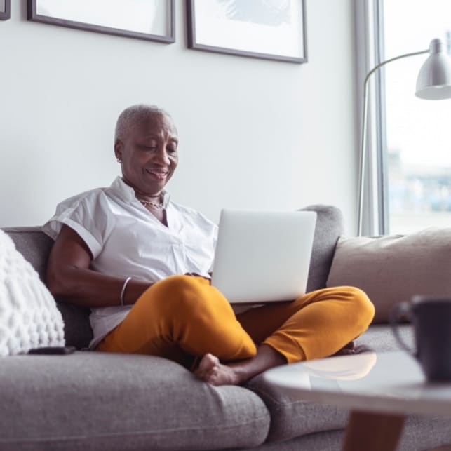 Woman On Couch With Laptop