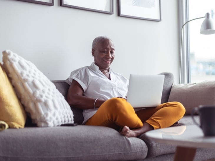 Woman On Couch With Laptop