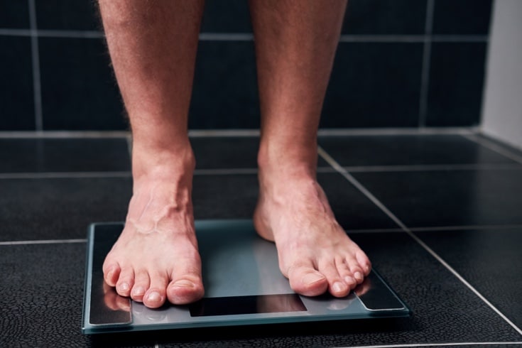 Man's feet on digital scale