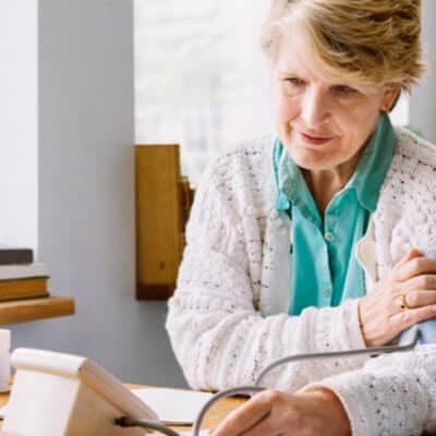 Woman In Sweater Taking Her Blood Pressure Readings