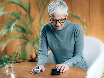 Woman Taking Pulse Ox Reading