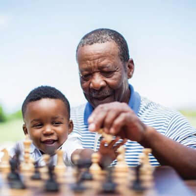 Man Playing Chess With Grandson