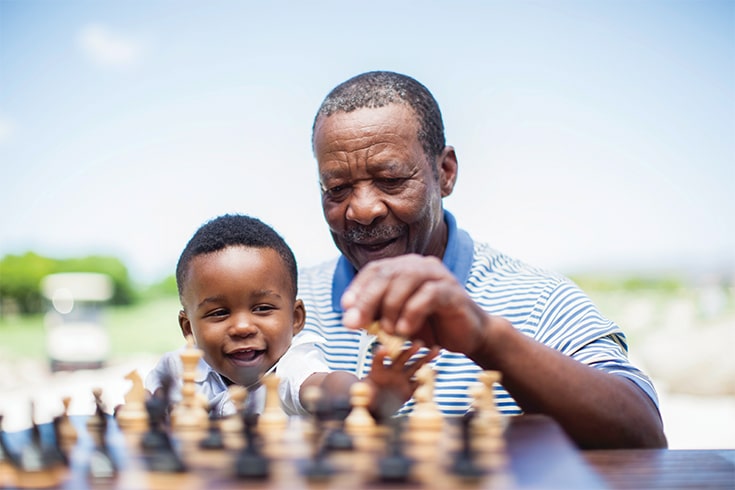 Man Playing Chess With Grandson